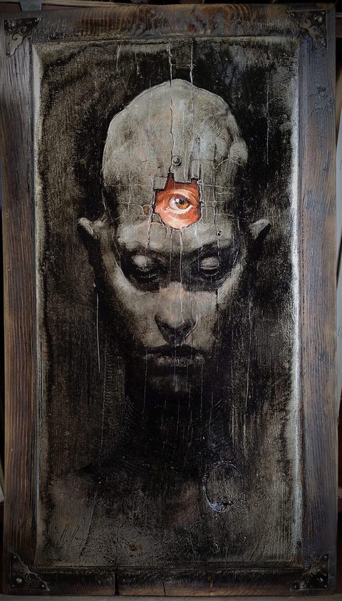 A Gaze from the Past: a grey head with closed eyes on dark cracked wood; through a broken patch in the forehead a vivid open eye looks out; the panel is framed in old boards with iron corner plates