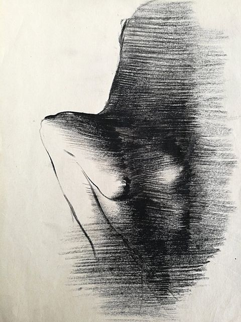 Nude in Charcoal I: a seated nude in charcoal, shoulder and breast in light, the rest in dark strokes