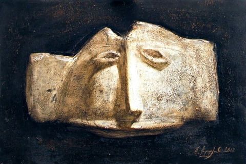 Face: a broken pale stone face in relief against black